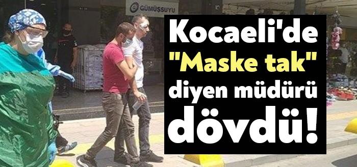 Kocaeli'nin Gölcük ilçesinde bir mağazada, müdür Salih Ergün maske takmasını