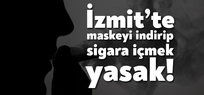İzmit İlçe Umumi Hıfzıssıhha Kurulu, maskeyi çene altına indirip sigara