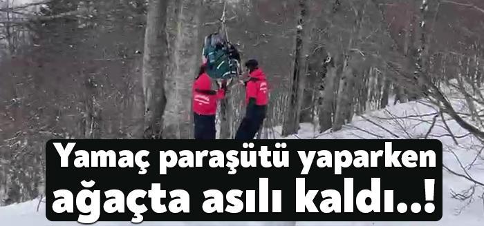 Kartepe Kayak Merkezinde yamaç paraşütü yapan kişi, esen sert rüzgarla
