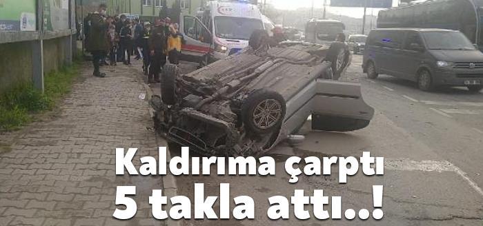 Kocaeli'nin Gölcük ilçesinde, sürücüsünün kontrolünden çıkan otomobil, kaldırıma çarpıp takla