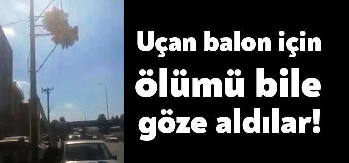 Kocaeli'nin Başiskele ilçesinde balon satıcısı bir vatandaş, uçup direğe takılan