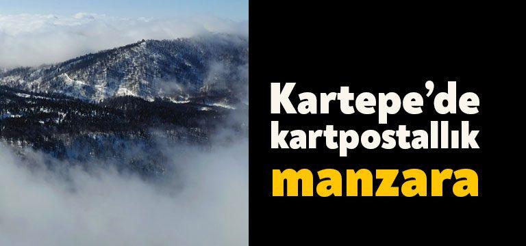 Beyaza bürünen Kartepe’de kar bulutlarının oluşturduğu manzara dron ile görüntülendi.