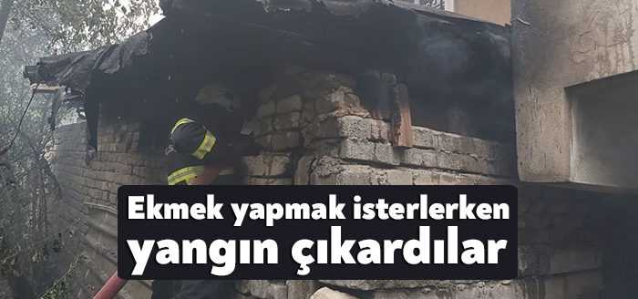 Kocaeli'nin Dilovası ilçesinde kadınların ekmek yapmak için fazla odun attığı