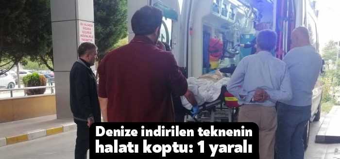 Kocaeli'de içinde mürettebat bulunan teknenin, yük gemisinden suya indirildiği sırada