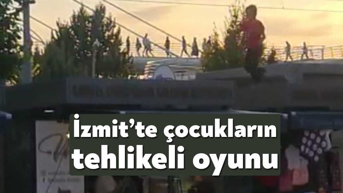  Kocaeli'de stantların çatısında zıplayan çocuklar, stant önünde oturan vatandaşları korkuttu.