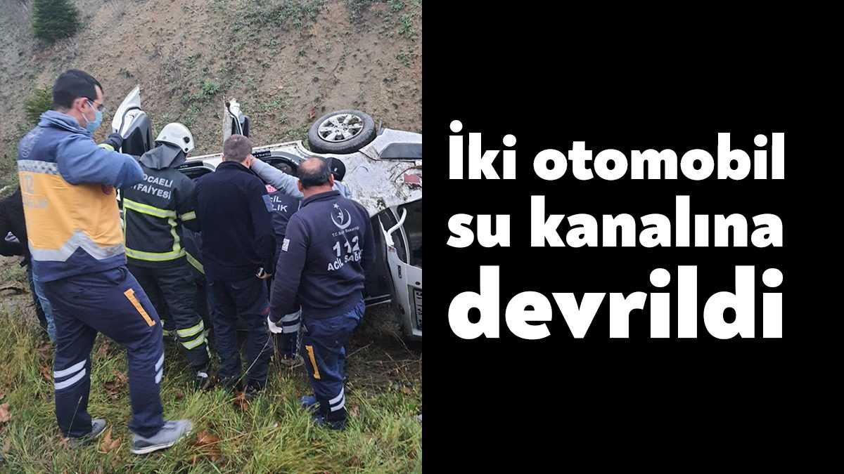 Kocaeli’de iki otomobilin su kanalına devrildiği kazada araçta sıkışan bir