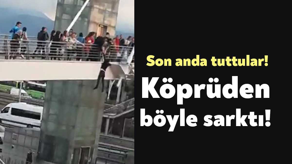 Kocaeli’nin İzmit ilçesinde köprüden tek eliyle tutunarak aşağı sarkan şahsı
