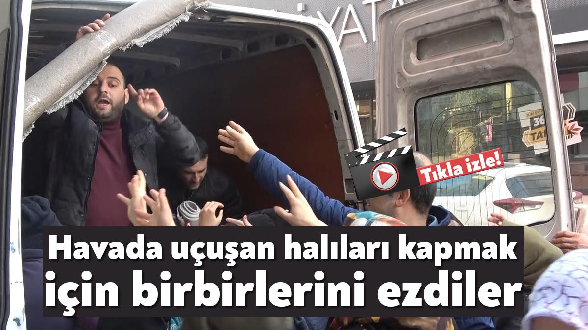 Kocaeli'nin Körfez ilçesinde bir halı mağazasının ücretsiz halı dağıttığı açılışta