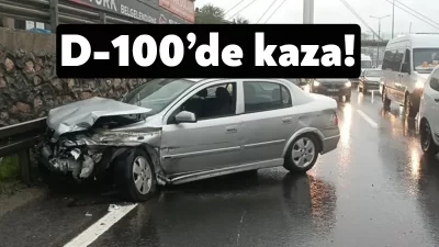 Kocaeli D100 Karayolu'nda yağış sebebiyle kayganlaşan yolda otomobil bariyere çarptı,