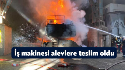 Dilovası'nda bir fabrikada iş makinesinde çıkan yangın, itfaiye ekiplerinin müdahalesiyle
