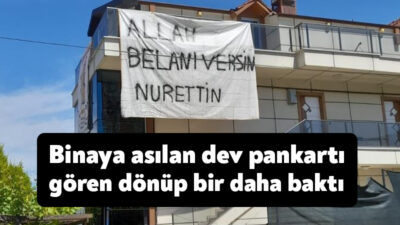 Kocaeli'nin Başiskele ilçesinde bir binaya asılan, "Allah belanı versin Nurettin"