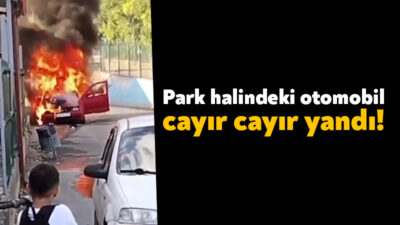Kocaeli’nin İzmit ilçesinde park halindeki otomobil alev alev yanarken, küçük