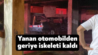 Kocaeli'nin Çayırova ilçesinde yanan otomobilden geriye iskeleti kalırken itfaiye ekipleri