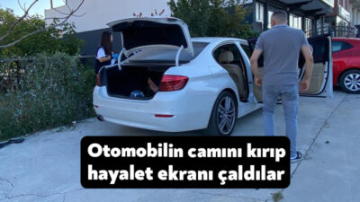 Kocaeli'nin Kartepe ilçesinde park halindeki otomobilin camı kırılarak "hayalet ekran"