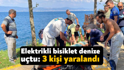 Kocaeli'nin Karamürsel ilçesinde seyir halindeki 3 tekerlekli elektrikli bisiklet kayalıklardan