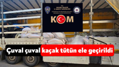 Kocaeli'nin İzmit ilçesinde durdurulan tırda arama yapan polis ekipleri, çuvallar