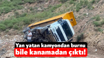 Kocaeli'nin Körfez ilçesinde yükün ağır gelmesi sonucu yan yatan kamyon,