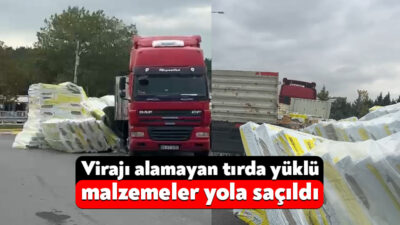 Kocaeli-İstanbul sınırında virajı alamayan tırın dorsesinde taşıdığı yükler yola saçıldı.