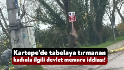 Kartepe’de bugün bir kadın iç çamaşırıyla tabelaya tırmanarak dans etti.
