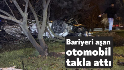 Kocaeli'nin İzmit ilçesinde kontrolden çıkan otomobil, bariyerleri aşıp ağaçlık alanda