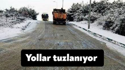 Dilovası'nda yoğun kar yağışı sonrasında ulaşımın aksamaması için yollar buzlanma
