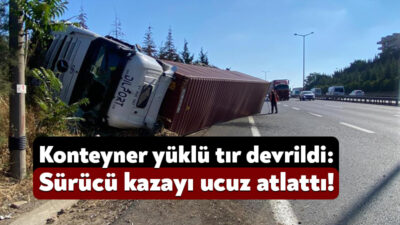 Kocaeli'nin İzmit ilçesi TEM otoyolu geçişinde konteyner yüklü tır devrildi.