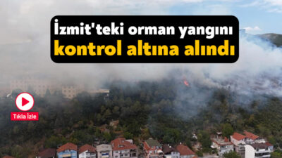 Kocaeli'nin İzmit ilçesinde ağaçlık alana sıçrayan yangın kontrol altına alınırken,